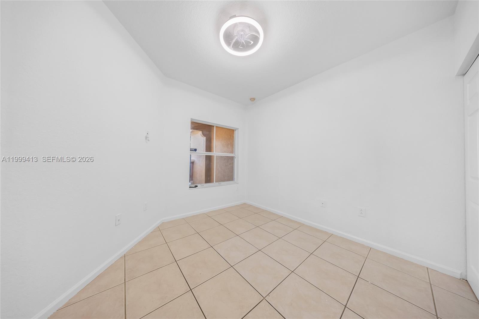 12040 Southwest 28th Street, Unit 4064 Miramar, FL 33025 - Photo 9 of 23 a view of a room that has a window in it