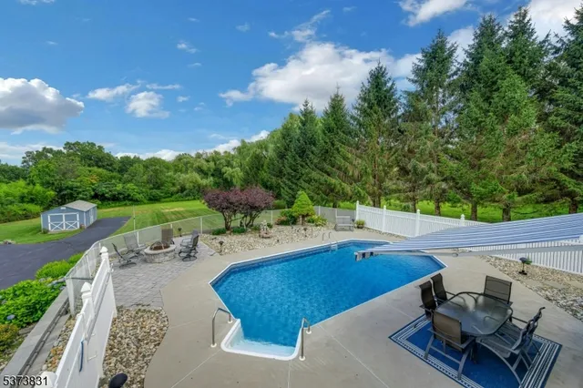 a view of a swimming pool with lounge chair