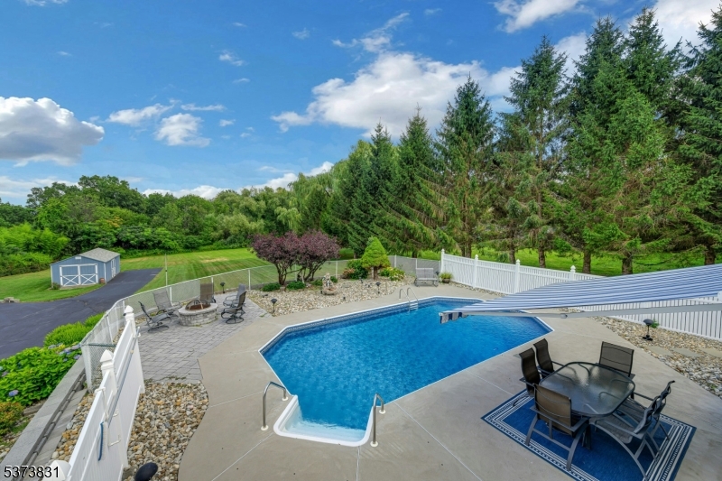 a view of a swimming pool with lounge chair