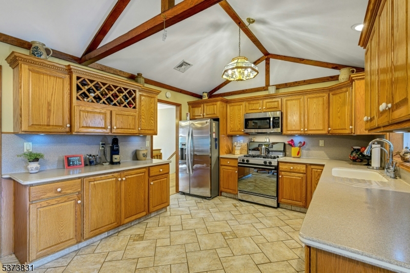 83 Hyatt Road Branchville, NJ 07826 - Photo 13 of 27 a kitchen with stainless steel appliances granite countertop a refrigerator a stove top oven a sink and dishwasher