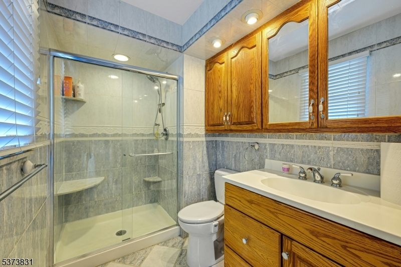 83 Hyatt Road Branchville, NJ 07826 - Photo 18 of 27 a bathroom with a sink toilet and shower