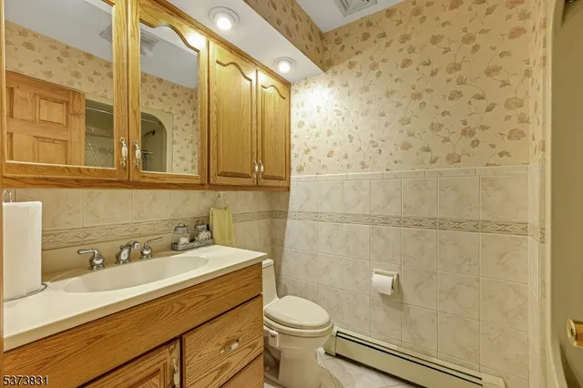 a bedroom with double bed and a chandelier