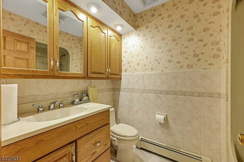83 Hyatt Road Branchville, NJ 07826 - Photo 19 of 27 a bathroom with a sink a toilet and shower