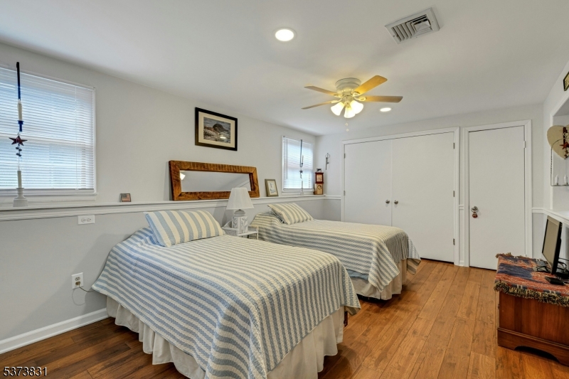 83 Hyatt Road Branchville, NJ 07826 - Photo 20 of 27 a bedroom with double bed and a chandelier