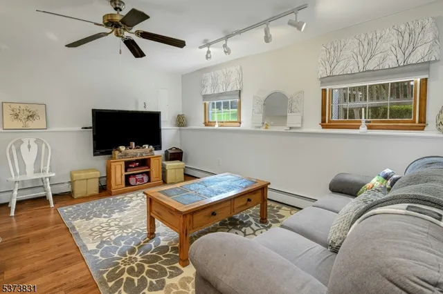 a spacious bedroom with a bed and a table in it