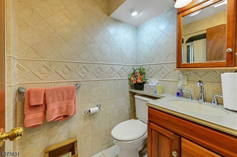 83 Hyatt Road Branchville, NJ 07826 - Photo 24 of 27 a bathroom with a sink a toilet and mirror