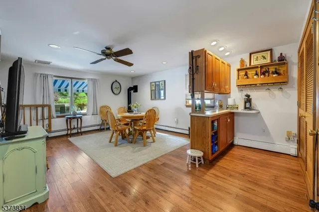 a kitchen with a stove a sink and a cabinetry