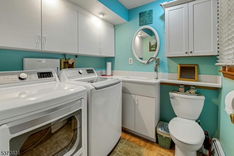 83 Hyatt Road Branchville, NJ 07826 - Photo 26 of 27 a kitchen with a stove a sink and a cabinetry