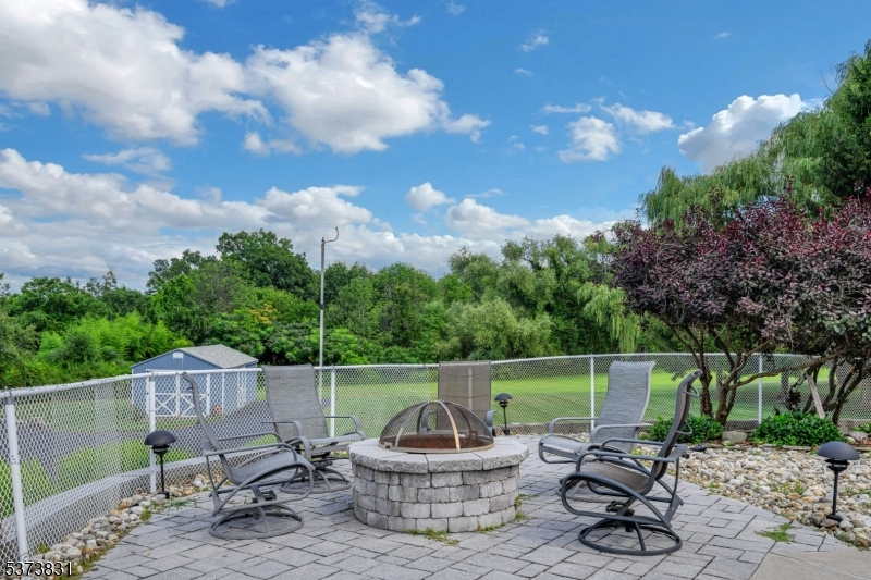 83 Hyatt Road Branchville, NJ 07826 - Photo 3 of 27 a backyard of a house with table and chairs