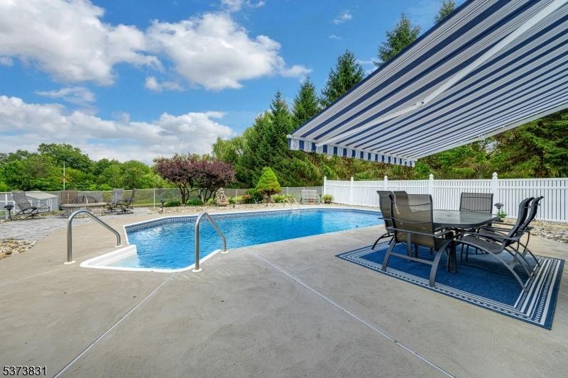 83 Hyatt Road Branchville, NJ 07826 - Photo 7 of 27 a swimming pool with outdoor seating