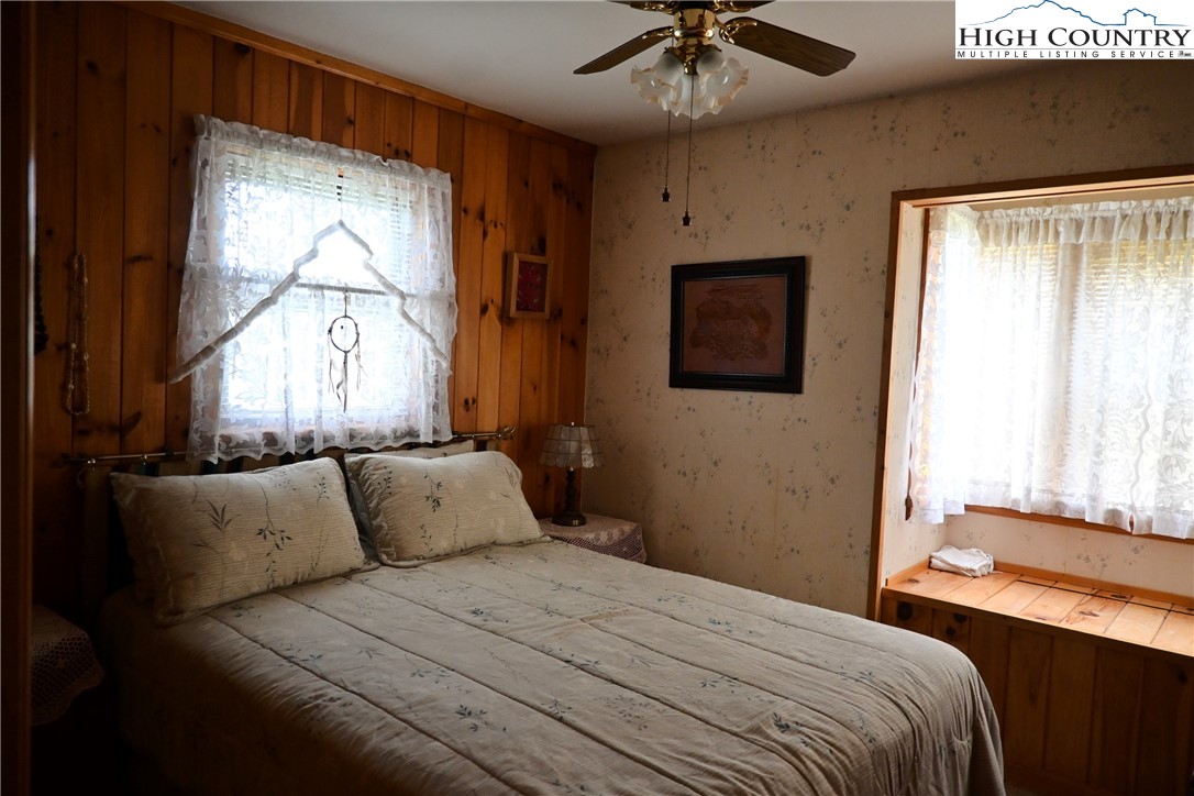 280 Smoky Hollow Road Laurel Springs, NC 28644 - Photo 18 of 42 a bedroom with a bed and a window