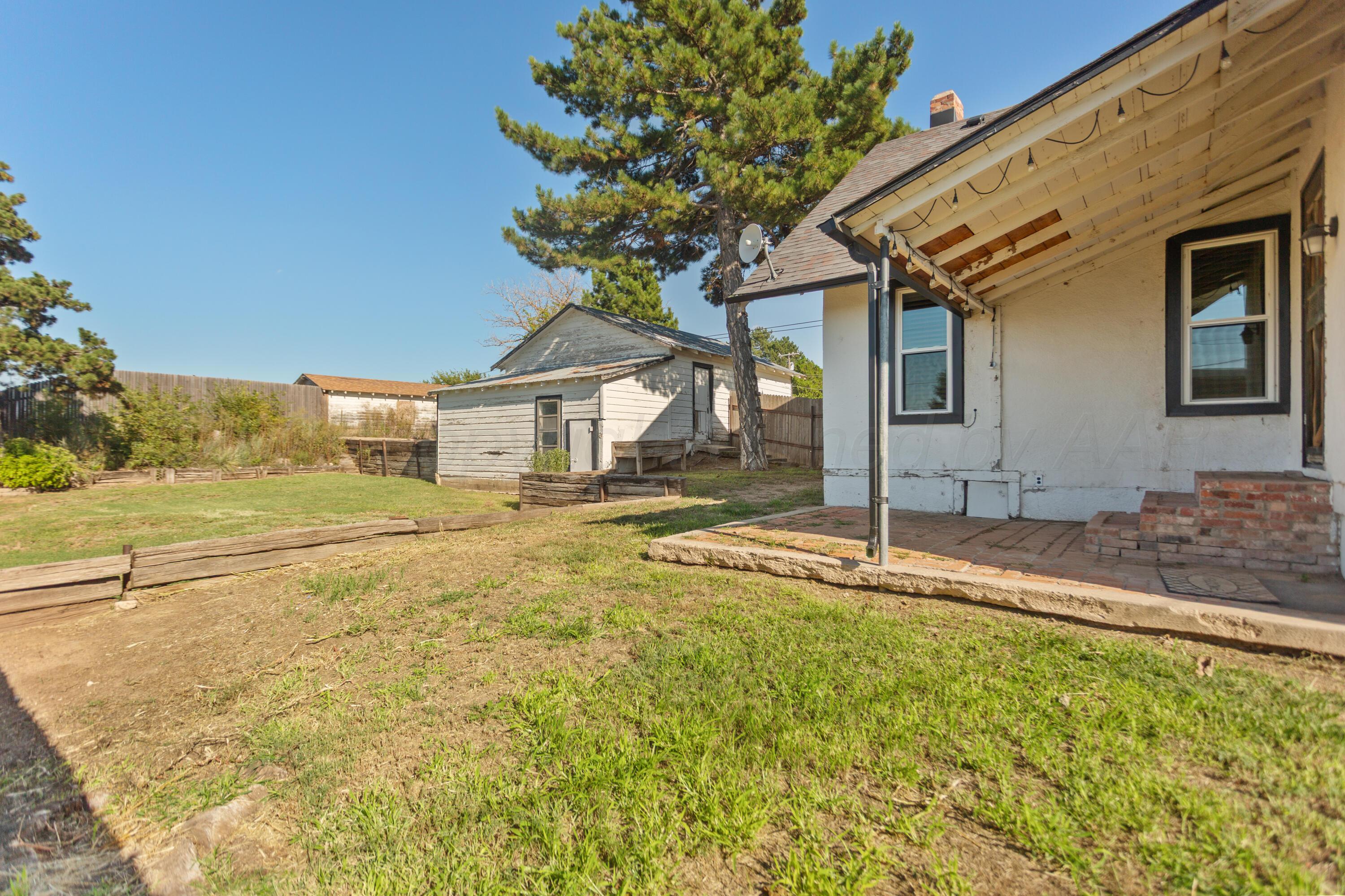 220 West Wichita Street Miami, TX 79059 - Photo 22 of 22 a house with trees in the background