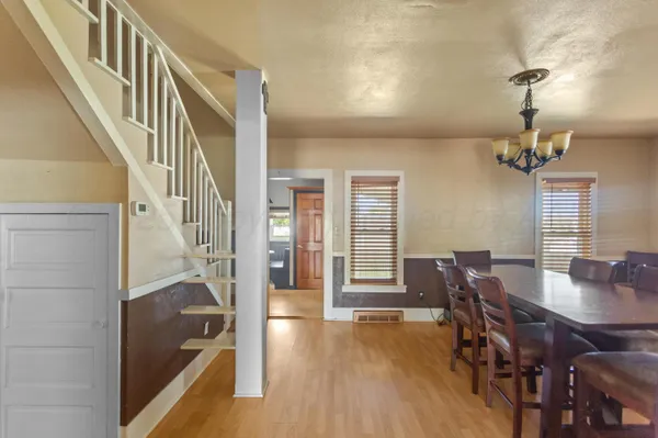 a view of a livingroom with furniture window and wooden floor