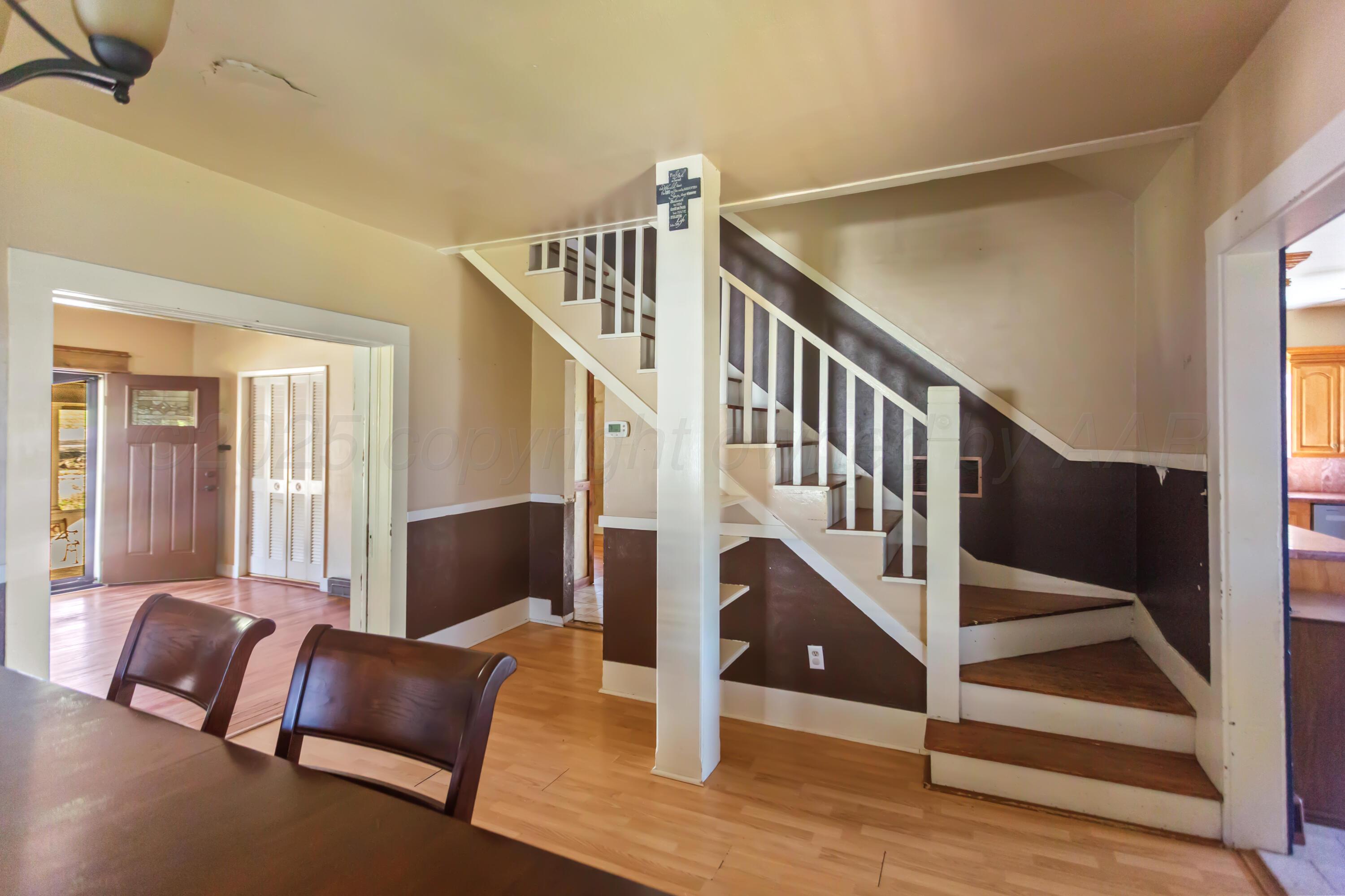 220 West Wichita Street Miami, TX 79059 - Photo 9 of 22 a view of staircase with furniture and stairs