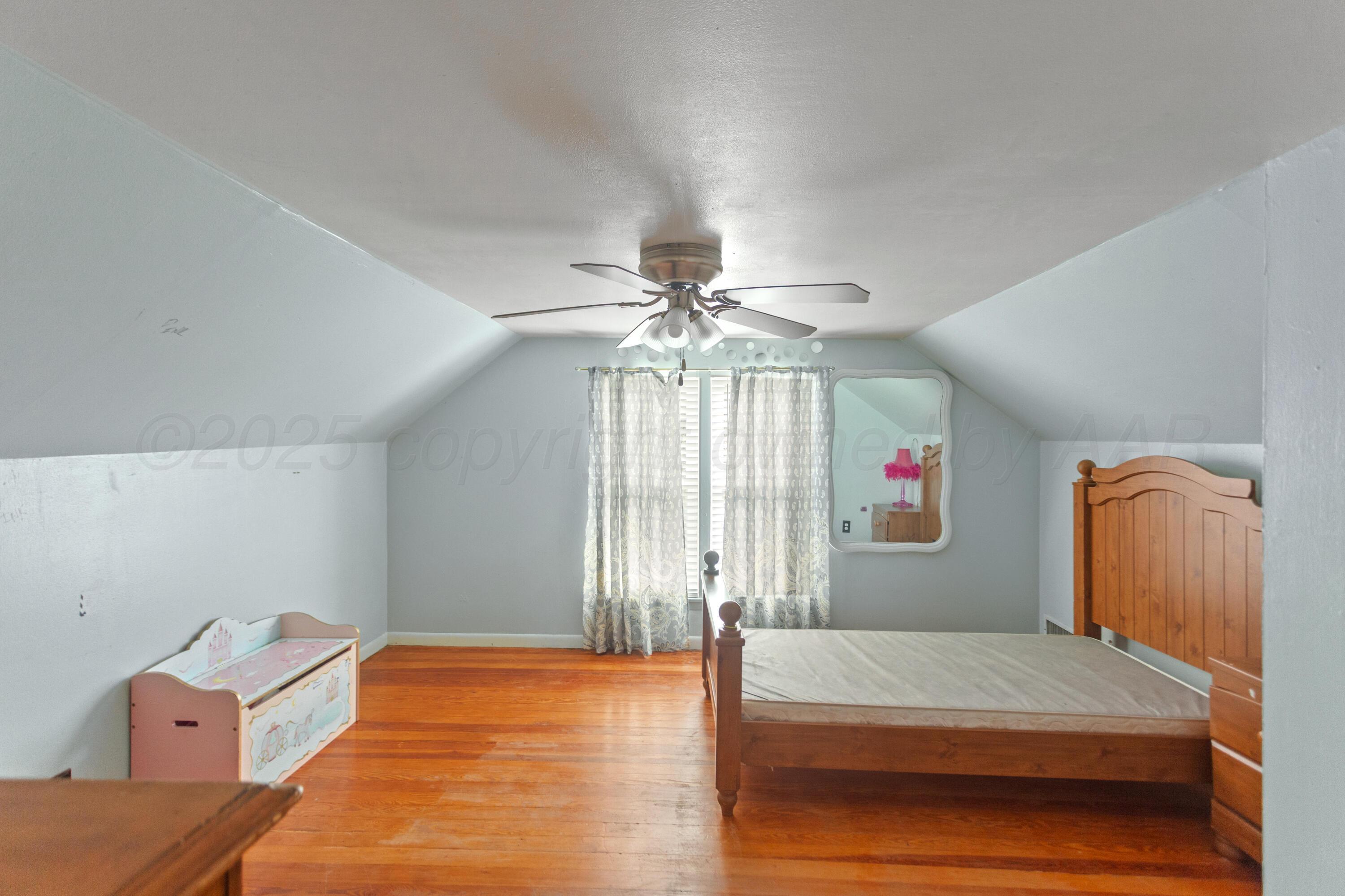 220 West Wichita Street Miami, TX 79059 - Photo 10 of 22 a bedroom with a bed and window