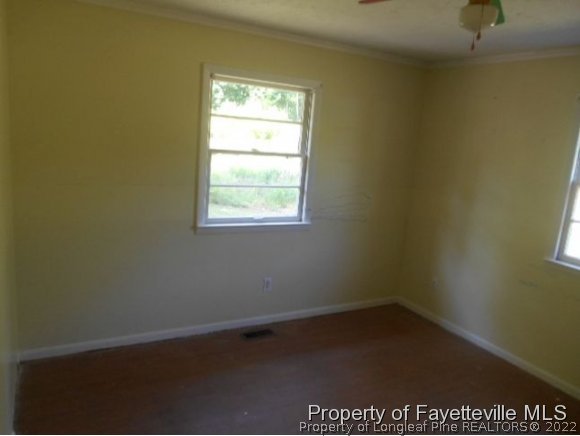 3255 Hayes Mill Road Godwin, NC 28344 - Photo 11 of 11 an empty room with a window