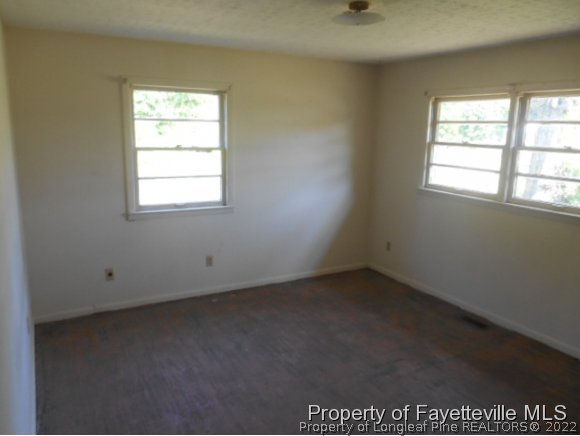3255 Hayes Mill Road Godwin, NC 28344 - Photo 6 of 11 an empty room with a window