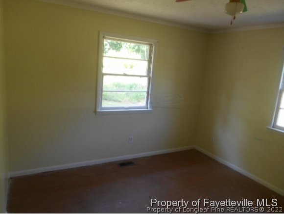 3255 Hayes Mill Road Godwin, NC 28344 - Photo 7 of 11 an empty room with a window