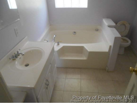 3255 Hayes Mill Road Godwin, NC 28344 - Photo 8 of 11 a bathroom with a bathtub