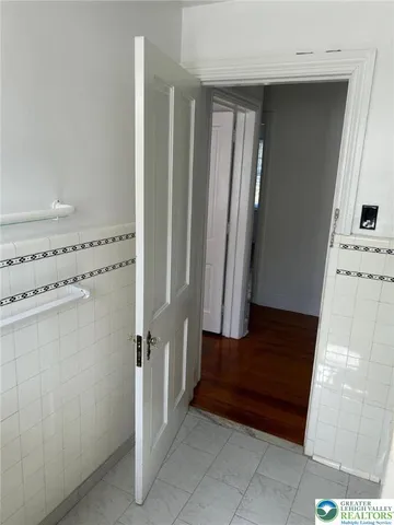 a view of a hallway with staircase