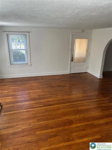 a view of an ocean window and wooden floor