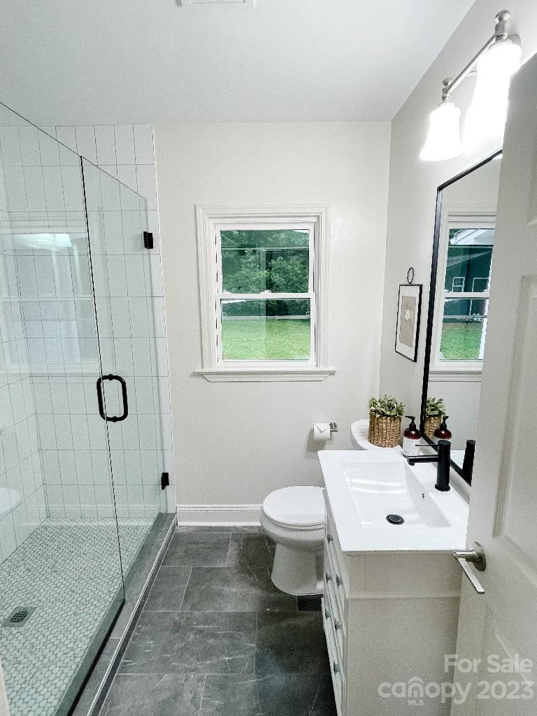 4232 Darwin Circle Charlotte, NC 28209 - Photo 12 of 24 a bathroom with a sink toilet and shower