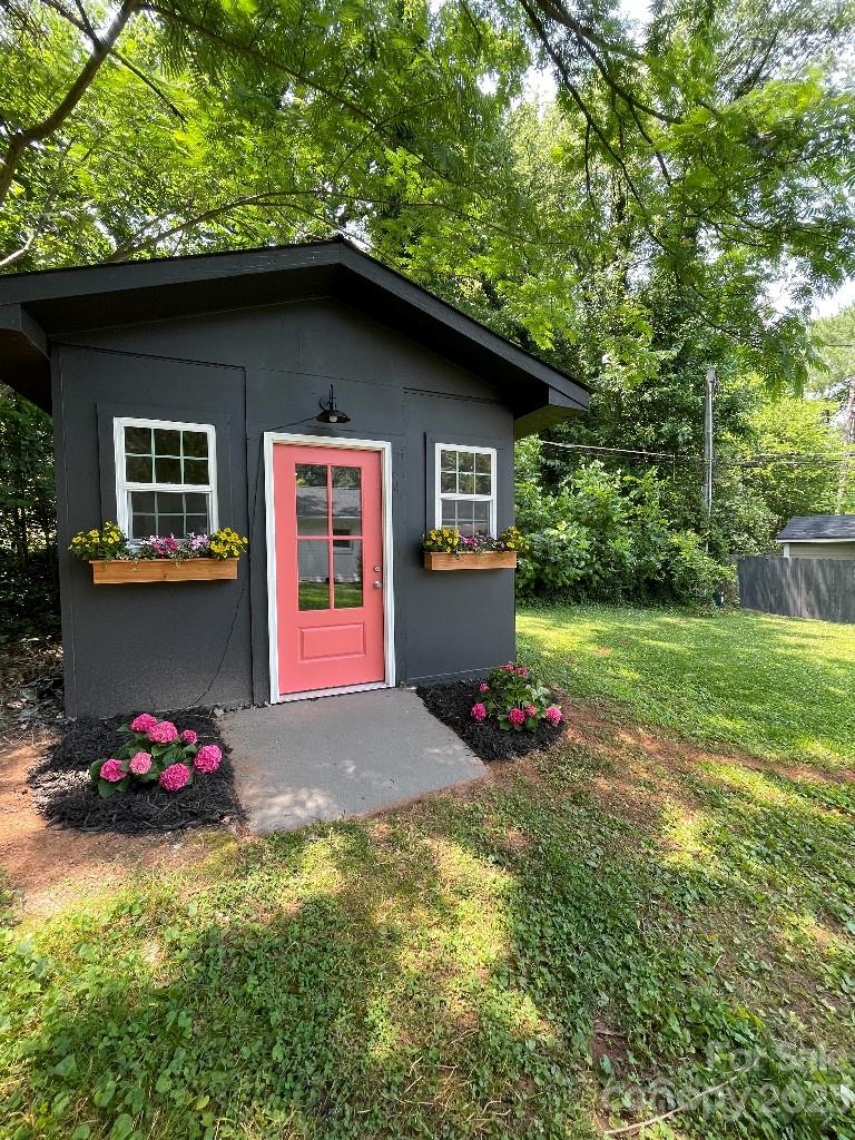 4232 Darwin Circle Charlotte, NC 28209 - Photo 16 of 24 a front view of a house with swing