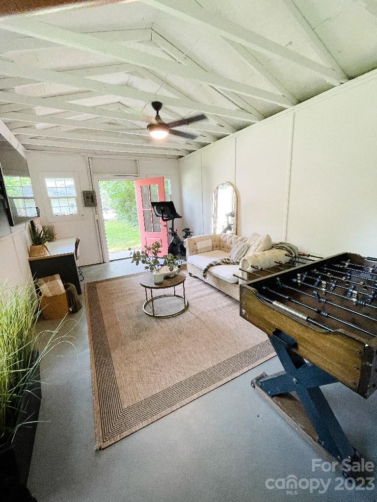 4232 Darwin Circle Charlotte, NC 28209 - Photo 18 of 24 a kitchen with stainless steel appliances granite countertop a sink dishwasher a stove a dining table and chairs with wooden floor