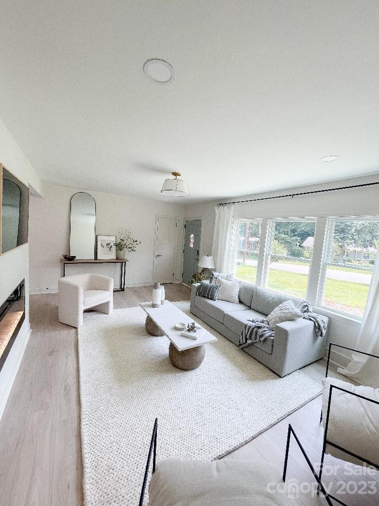 4232 Darwin Circle Charlotte, NC 28209 - Photo 21 of 24 a living room with furniture and a large window