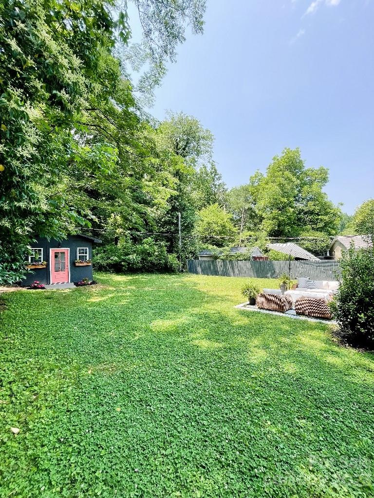 4232 Darwin Circle Charlotte, NC 28209 - Photo 24 of 24 a view of a garden with a bench in the garden
