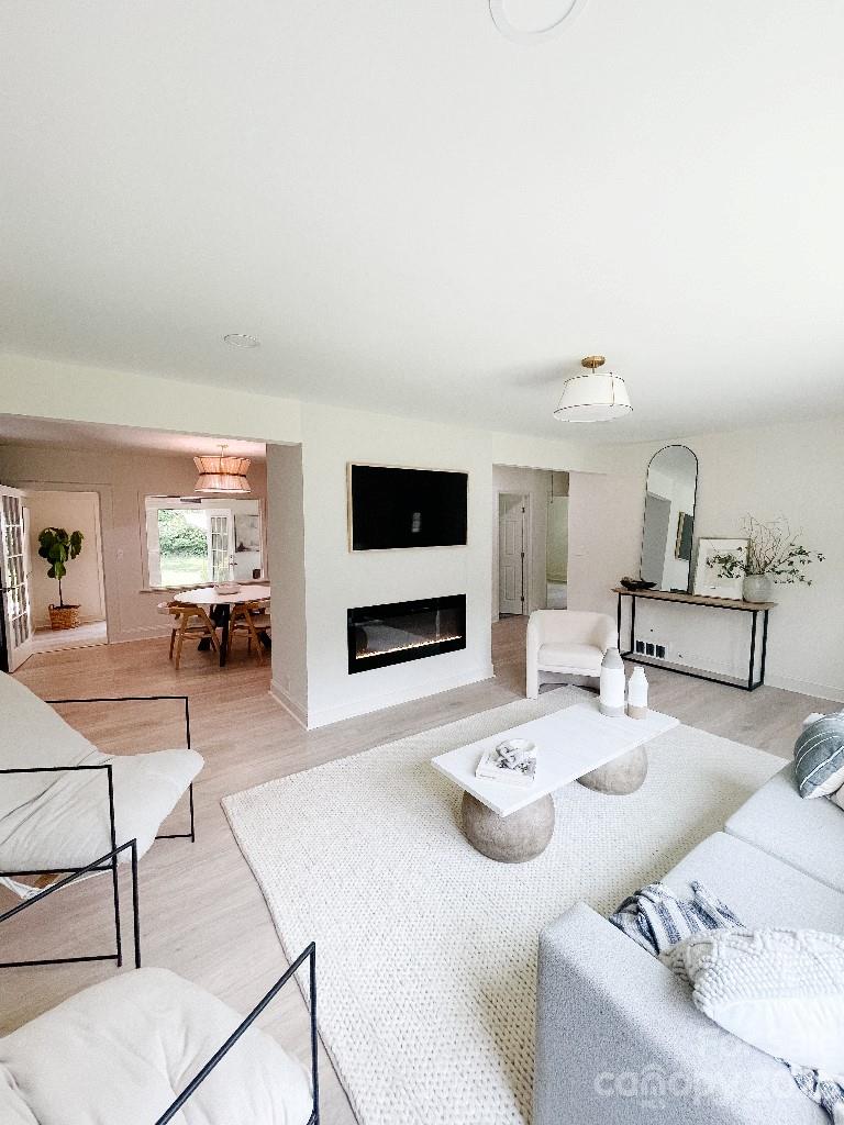 4232 Darwin Circle Charlotte, NC 28209 - Photo 3 of 24 a living room with furniture and a flat screen tv