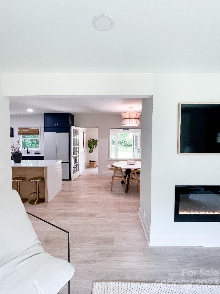 4232 Darwin Circle Charlotte, NC 28209 - Photo 5 of 24 a living room with furniture and a flat screen tv