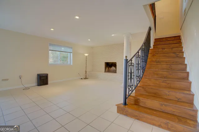 a view of an empty room with stairs