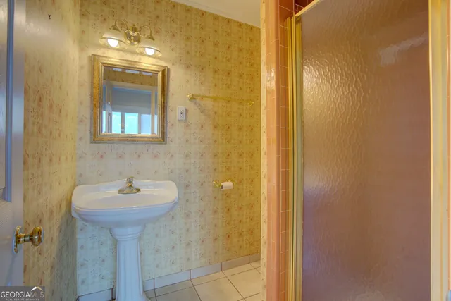 a view of a room with furniture and wooden floor