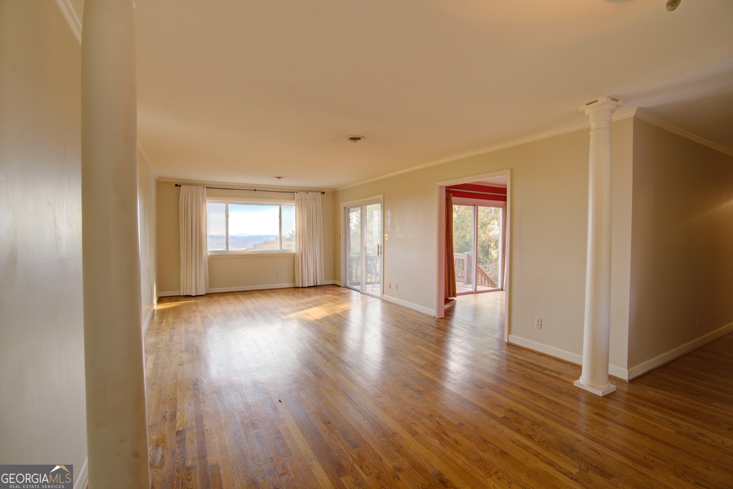 46 Turnbull Drive Rome, GA 30161 - Photo 4 of 47 a view of an empty room with wooden floor and windows