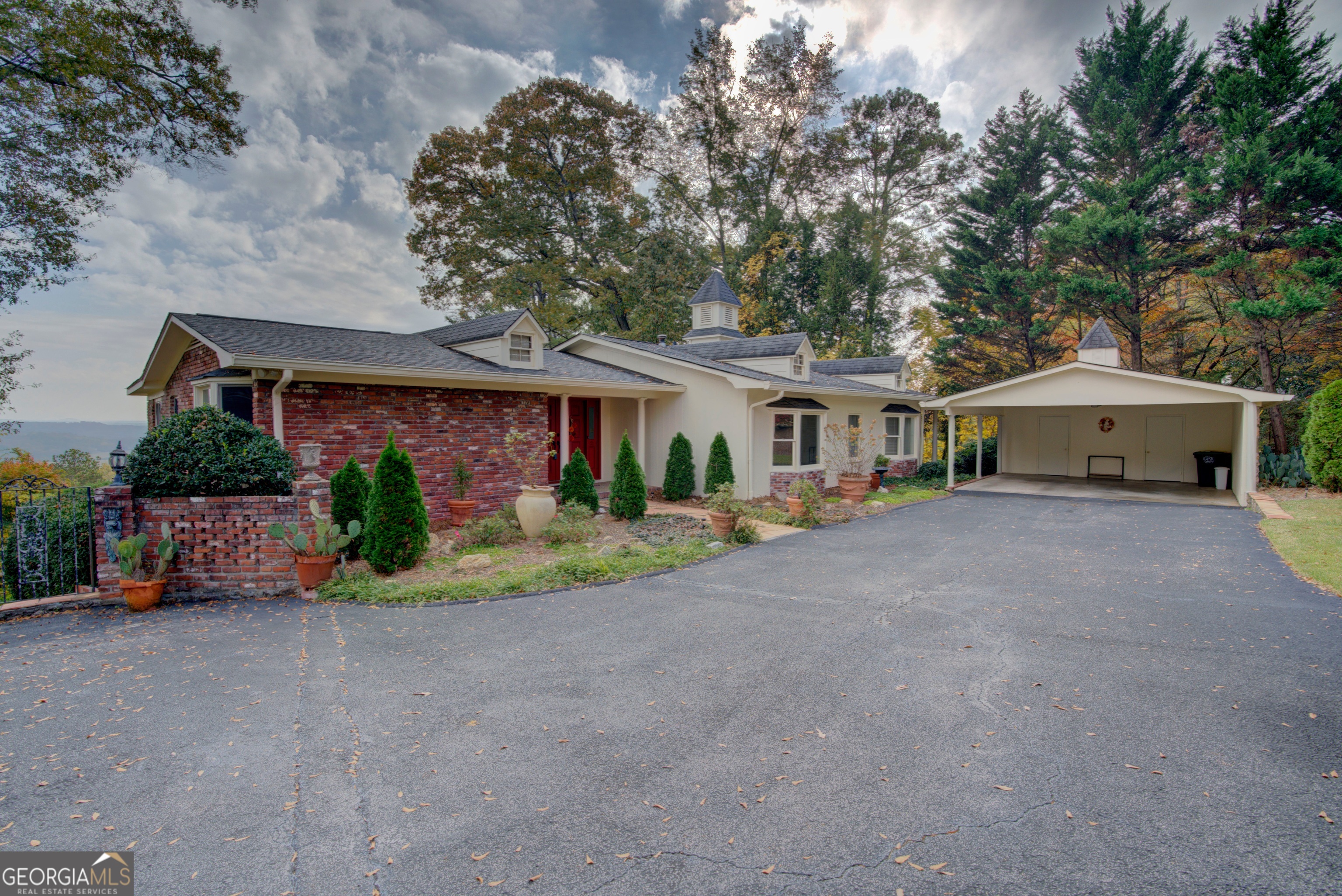 46 Turnbull Drive Rome, GA 30161 - Photo 44 of 47 a front view of a house with a yard and potted plants