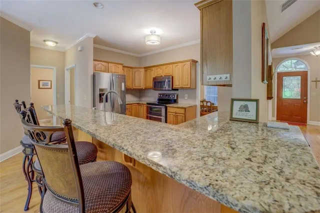 a view of a kitchen and dining room
