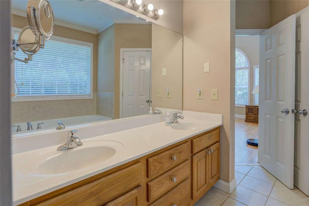 1041 Flat Rock Road Covington, GA 30014 - Photo 20 of 59 a bathroom with a sink and a mirror