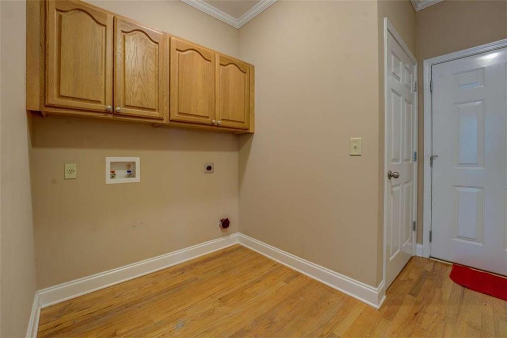 1041 Flat Rock Road Covington, GA 30014 - Photo 26 of 59 a view of a room with wooden floor and cabinets