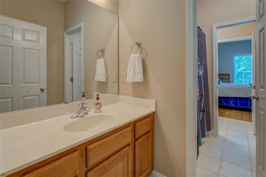 1041 Flat Rock Road Covington, GA 30014 - Photo 29 of 59 a bathroom with a sink and a mirror