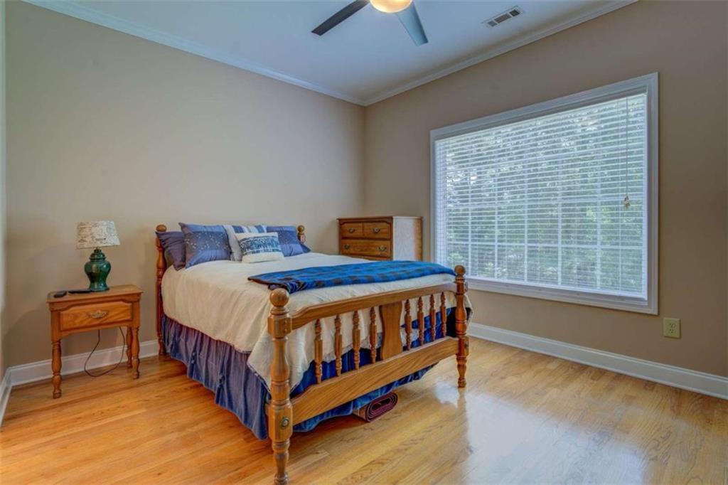 1041 Flat Rock Road Covington, GA 30014 - Photo 30 of 59 a bedroom with a bed and a window