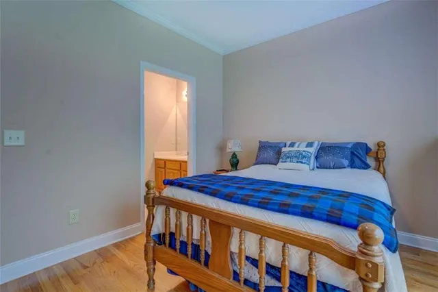 an empty room with windows and chandelier fan