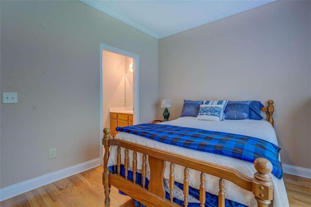 1041 Flat Rock Road Covington, GA 30014 - Photo 31 of 59 a bedroom with a bed and a window