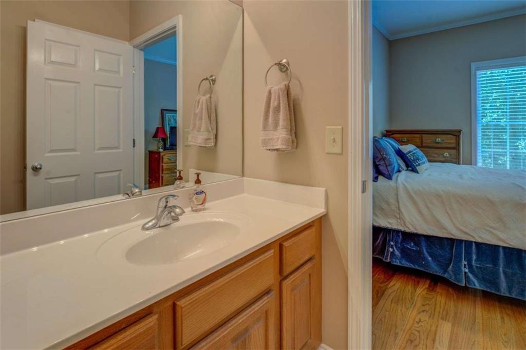 1041 Flat Rock Road Covington, GA 30014 - Photo 32 of 59 a en suite bathroom with a sink and a mirror
