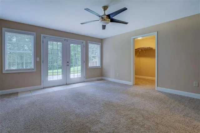 a view of a two chairs in the garden