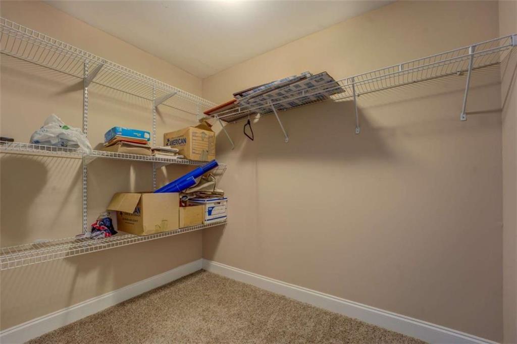 1041 Flat Rock Road Covington, GA 30014 - Photo 45 of 59 a view of storage and utility room with racks on the wall