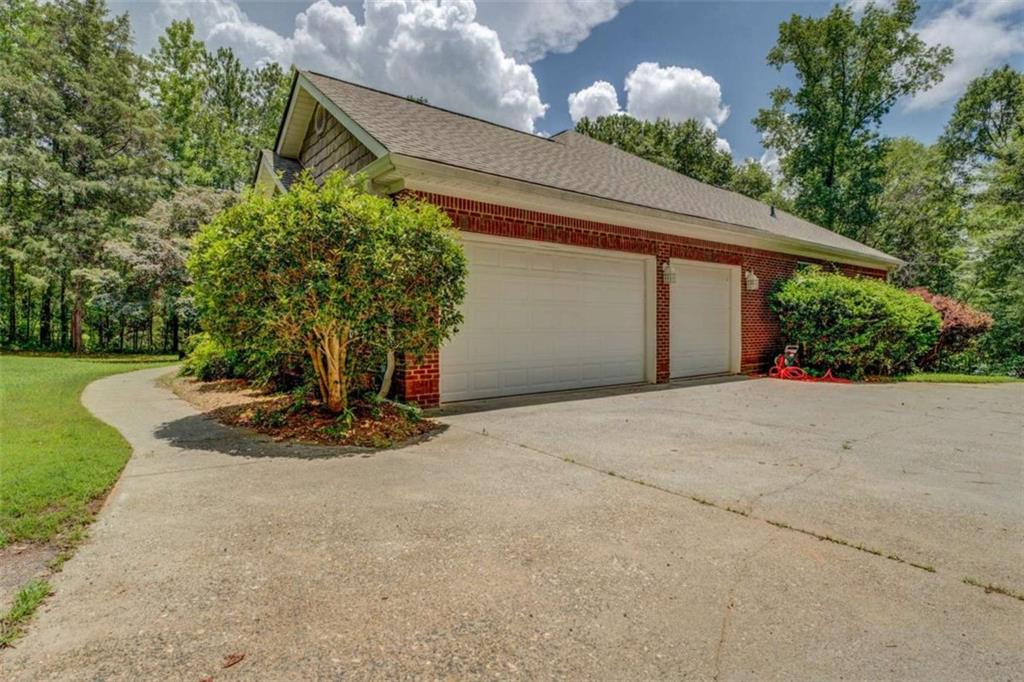 1041 Flat Rock Road Covington, GA 30014 - Photo 59 of 59 a vase of flowers sitting on a floor in front of a house