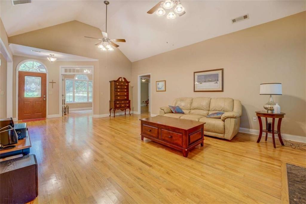 1041 Flat Rock Road Covington, GA 30014 - Photo 9 of 59 a spacious bedroom with a bed and a table in it