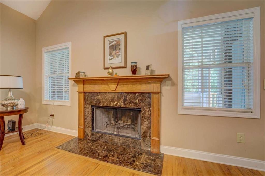 1041 Flat Rock Road Covington, GA 30014 - Photo 10 of 59 a living room with a fireplace and a table