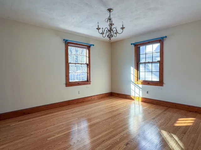 a view of an entryway with wooden floor